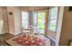 Bright breakfast nook with sliding glass doors to the backyard and a cozy seating area, filled with natural light at 716 Bristol Ct, Greenwood, IN 46143