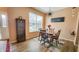 Dining room with seating for four, hardwood floors, a modern light fixture, and a sign with a positive message at 716 Bristol Ct, Greenwood, IN 46143