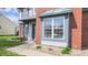 Close up of a beautiful two-story home with brick and vinyl siding in a suburban neighborhood at 716 Bristol Ct, Greenwood, IN 46143