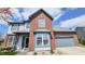 Beautiful two-story home featuring brick and vinyl siding with an attached garage in a suburban neighborhood at 716 Bristol Ct, Greenwood, IN 46143