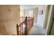A view of an open hallway on the upper level of a home with natural lighting at 716 Bristol Ct, Greenwood, IN 46143