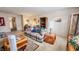 Comfortable living room featuring plaid furniture, lamps, and tasteful decor at 716 Bristol Ct, Greenwood, IN 46143