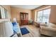 Comfortable living room with hardwood floors and neutral walls with a large window at 716 Bristol Ct, Greenwood, IN 46143