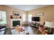 Inviting living room featuring a fireplace, cozy seating, and ample natural light from the large windows at 716 Bristol Ct, Greenwood, IN 46143