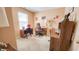 Home office featuring two work stations, a comfortable chair, and natural light at 716 Bristol Ct, Greenwood, IN 46143