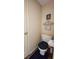 Powder room with a toilet, decor, and door at 716 Bristol Ct, Greenwood, IN 46143