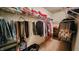 Walk-in closet with ample storage space, organized hanging clothes, and shelving at 716 Bristol Ct, Greenwood, IN 46143