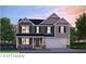 Charming craftsman-style home with a two-car garage and welcoming covered porch at 717 Lake Vista Dr, Columbus, IN 47201