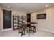 Spacious office area with rustic desk, chalkboard panels, storage shelves, and comfortable seating at 7282 Portico Ln, McCordsville, IN 46055