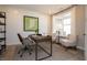 Home office with natural light, a modern desk, comfortable seating, and stylish decor at 7282 Portico Ln, McCordsville, IN 46055