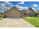 Charming home featuring a two-car garage, brick accents, manicured lawn, and inviting curb appeal at 7608 Andrew Turn, Plainfield, IN 46168
