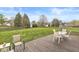 Backyard deck with patio furniture overlooking a spacious lawn and mature trees at 7715 High View Cir, Indianapolis, IN 46236