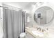 Cozy bathroom with granite countertop, large mirror, vanity and neutral decor at 7715 High View Cir, Indianapolis, IN 46236