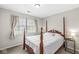 Bedroom with four-poster bed, neutral color scheme and natural light at 7715 High View Cir, Indianapolis, IN 46236