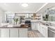 Bright kitchen featuring stainless steel appliances, a center island, and modern finishes at 7715 High View Cir, Indianapolis, IN 46236