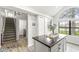 Bright kitchen featuring stainless steel appliances, a center island, and natural lighting at 7715 High View Cir, Indianapolis, IN 46236