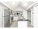 Bright kitchen featuring stainless steel appliances, a center island, and modern finishes at 7715 High View Cir, Indianapolis, IN 46236