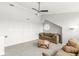Cozy upstairs living area with plush sofas, a round wooden coffee table, and neutral carpeting at 7715 High View Cir, Indianapolis, IN 46236