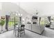 Bright living room with large windows, a fireplace, and comfortable seating at 7715 High View Cir, Indianapolis, IN 46236