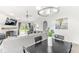 Open living room features a fireplace, ceiling fan and sliding door access to the backyard at 7715 High View Cir, Indianapolis, IN 46236