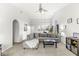 Bright living room with vaulted ceilings, large arched window, and fireplace at 7715 High View Cir, Indianapolis, IN 46236