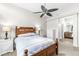 Comfortable bedroom with a ceiling fan, bedside tables, and a doorway to the ensuite bathroom at 7715 High View Cir, Indianapolis, IN 46236