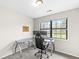 Bright home office features a large window, desk and views of the backyard at 7715 High View Cir, Indianapolis, IN 46236