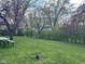 Lush backyard with open green space and picnic table, perfect for outdoor enjoyment at 7740 5 Points Rd, Indianapolis, IN 46259