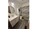 Bathroom features a white vanity, matching wall cabinet, and shower with decorative curtain at 7740 5 Points Rd, Indianapolis, IN 46259
