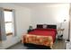 Inviting bedroom with a cozy bed, soft lighting, and a serene ambiance with outside views at 7740 5 Points Rd, Indianapolis, IN 46259