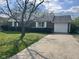 Charming brick home with well-maintained landscaping and an attached one car garage at 7740 5 Points Rd, Indianapolis, IN 46259