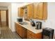 Functional kitchen featuring wooden cabinets and modern appliances for convenient meal preparation at 7740 5 Points Rd, Indianapolis, IN 46259