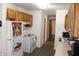 Well-lit kitchen with updated appliances and ample counter space for cooking and meal prep at 7740 5 Points Rd, Indianapolis, IN 46259