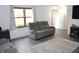 Cozy living room with a plush reclining sofa, modern furnishings, and stylish decor at 7740 5 Points Rd, Indianapolis, IN 46259