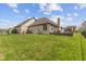Expansive backyard with lush green grass and a charming, wooden deck at 8095 Christopher Ct, Avon, IN 46123