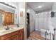 Bathroom features a wood vanity with a sink and mirror above and toilet at 8095 Christopher Ct, Avon, IN 46123