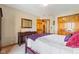 Cozy bedroom with neutral colored carpet, bed and furnishings, and large double door closet at 8095 Christopher Ct, Avon, IN 46123