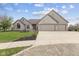 Lovely brick home with a three car garage, mature landscaping and inviting curb appeal at 8095 Christopher Ct, Avon, IN 46123