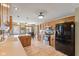 Bright eat-in kitchen with wood cabinets, stainless appliances, and hardwood floors at 8095 Christopher Ct, Avon, IN 46123