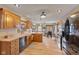Well-lit kitchen with wood cabinets, modern appliances, and access to the dining area at 8095 Christopher Ct, Avon, IN 46123