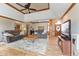 Open concept living room with a fireplace, trey ceiling, and plenty of seating at 8095 Christopher Ct, Avon, IN 46123