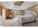Luxurious main bedroom featuring tray ceilings, neutral tones, and a sitting area by the window at 8095 Christopher Ct, Avon, IN 46123