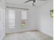 Bedroom features white walls, neutral carpet, ceiling fan and good natural light at 8235 Picadilly Ln, Indianapolis, IN 46256
