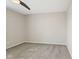 This bedroom offers neutral carpet, a ceiling fan and nice natural light at 8235 Picadilly Ln, Indianapolis, IN 46256