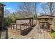 Wooden deck with a gazebo, shed, and furniture at 8235 Picadilly Ln, Indianapolis, IN 46256