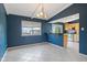 Eat-in kitchen features tile floors, granite countertops and a large window with views of the outdoor gazebo at 8235 Picadilly Ln, Indianapolis, IN 46256