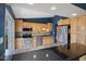 Kitchen showcases stainless appliances, granite countertops, light wood cabinets and lots of light at 8235 Picadilly Ln, Indianapolis, IN 46256