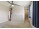 Main bedroom offers neutral carpet, a ceiling fan and access to the ensuite bath at 8235 Picadilly Ln, Indianapolis, IN 46256