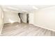 View of the finished basement with stairs, vinyl flooring and neutral walls at 8506 Friendship Ln, Indianapolis, IN 46217