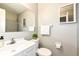 Bathroom features a large mirror, vanity, and toilet at 8506 Friendship Ln, Indianapolis, IN 46217